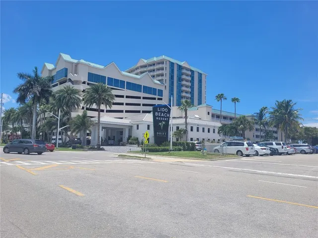 a sign that is sitting on a brick wall