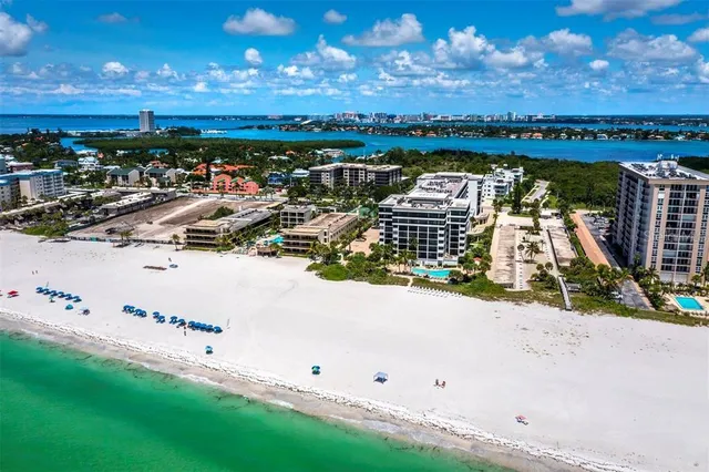 a front view of a building with a garden