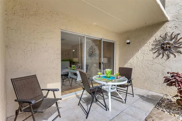 a swimming pool with outdoor seating