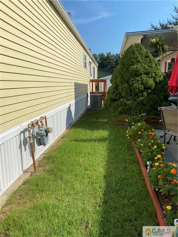 7 Poe Road North Brunswick, NJ 08902 - Photo 6 of 19 a view of a house with backyard and sitting area