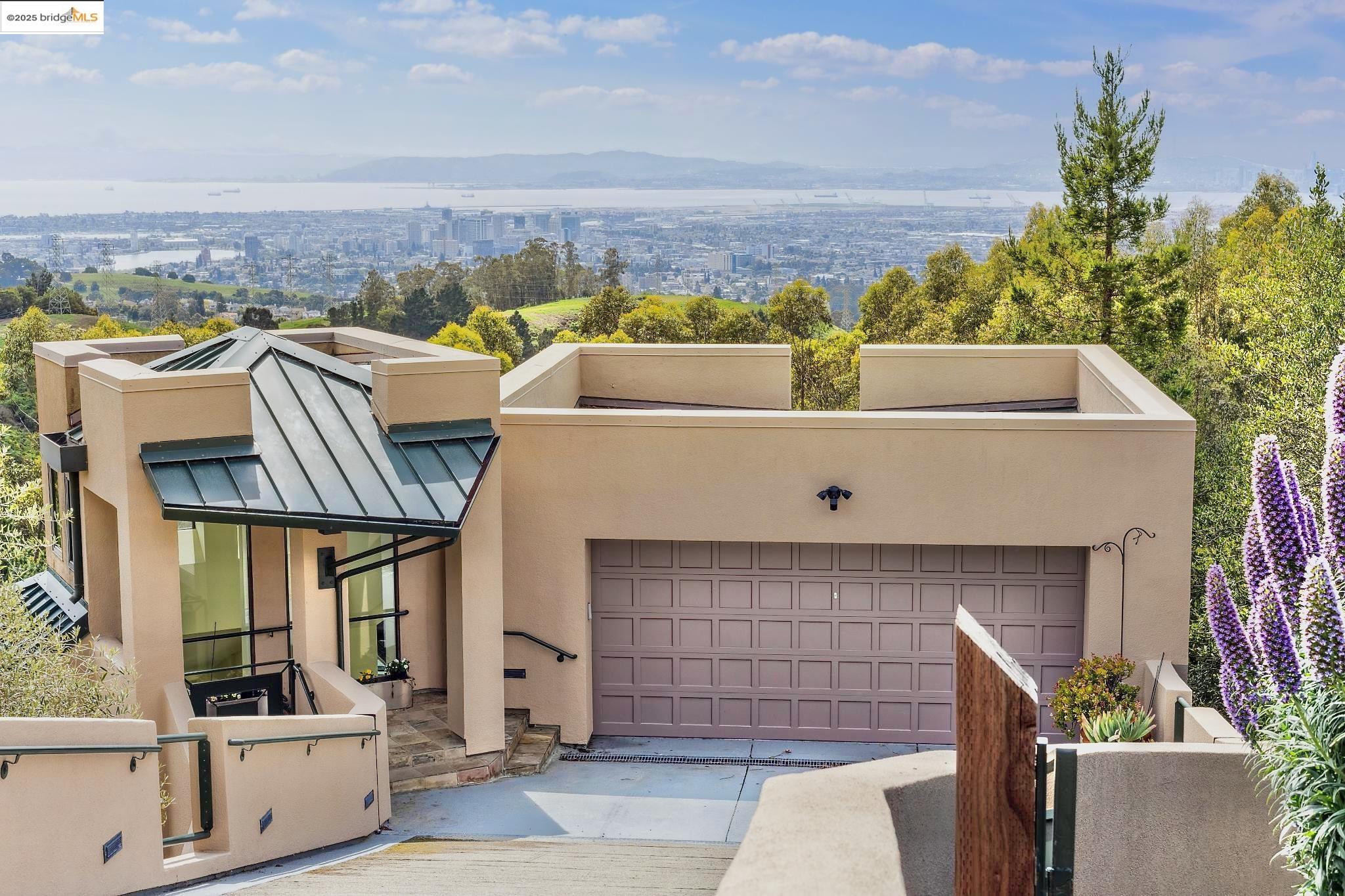 5959 Skyline Boulevard Oakland, CA 94611 - Photo 1 of 1 a view of building with outdoor space and seating area