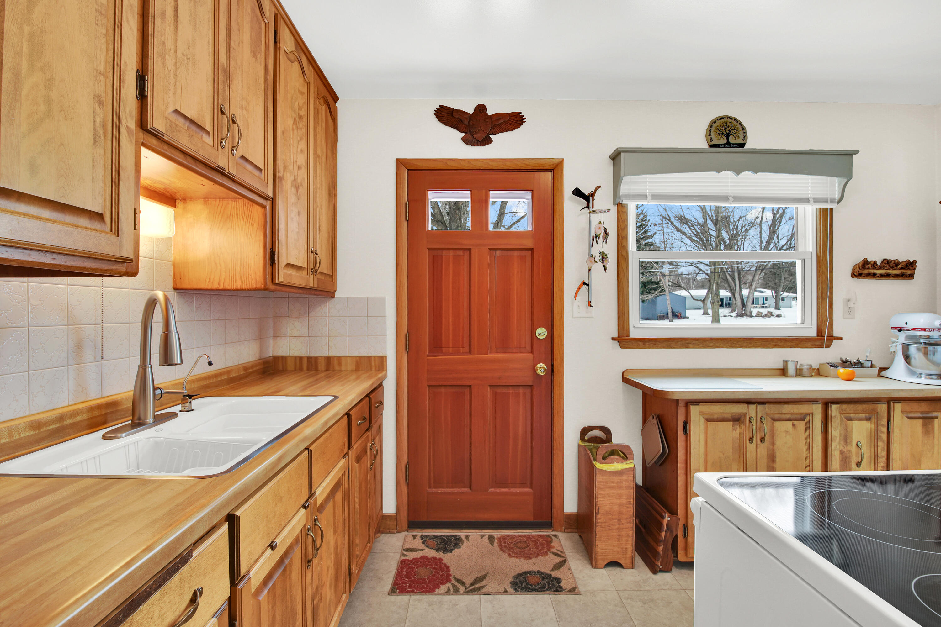 W150S6441 Spring Lane Muskego, WI 53150 - Photo 7 of 24 Door to deck and backyard