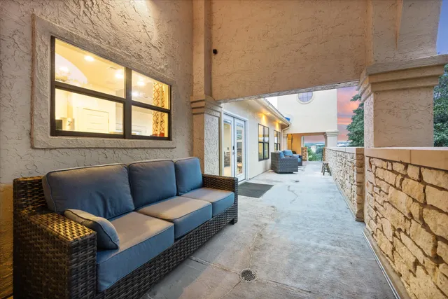 a view of living room filled with furniture and a rug