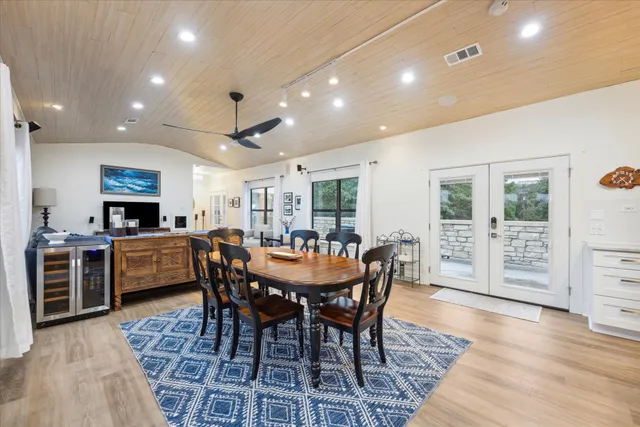 a dining room with furniture and wooden floor
