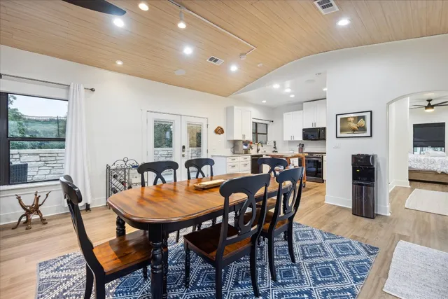 a view of a dining room with furniture and wooden floor