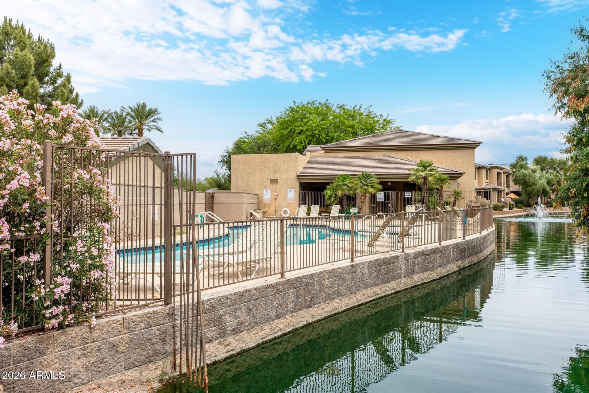 a view of a swimming pool with a patio
