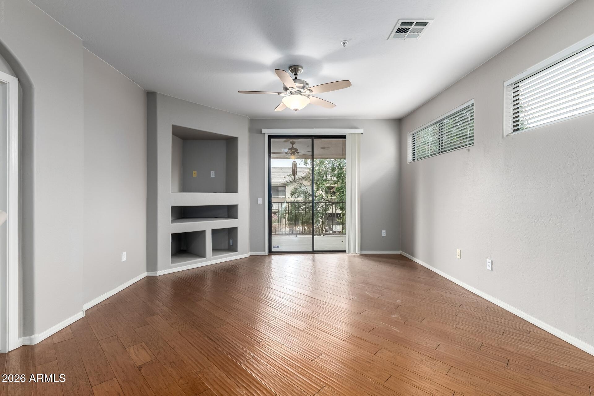 705 West Queen Creek Road, Unit 2114 Chandler, AZ 85248 - Photo 12 of 36 a view of an empty room with a window and fireplace