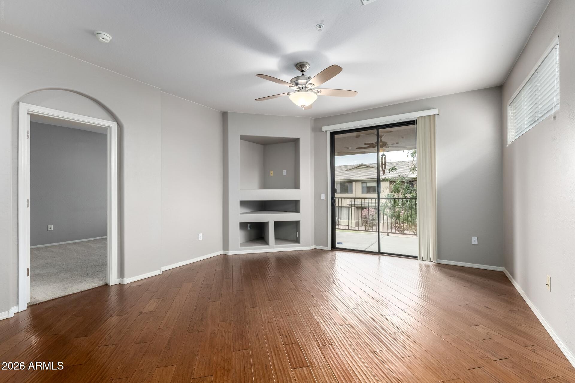 705 West Queen Creek Road, Unit 2114 Chandler, AZ 85248 - Photo 13 of 36 wooden floor in an empty room with a window