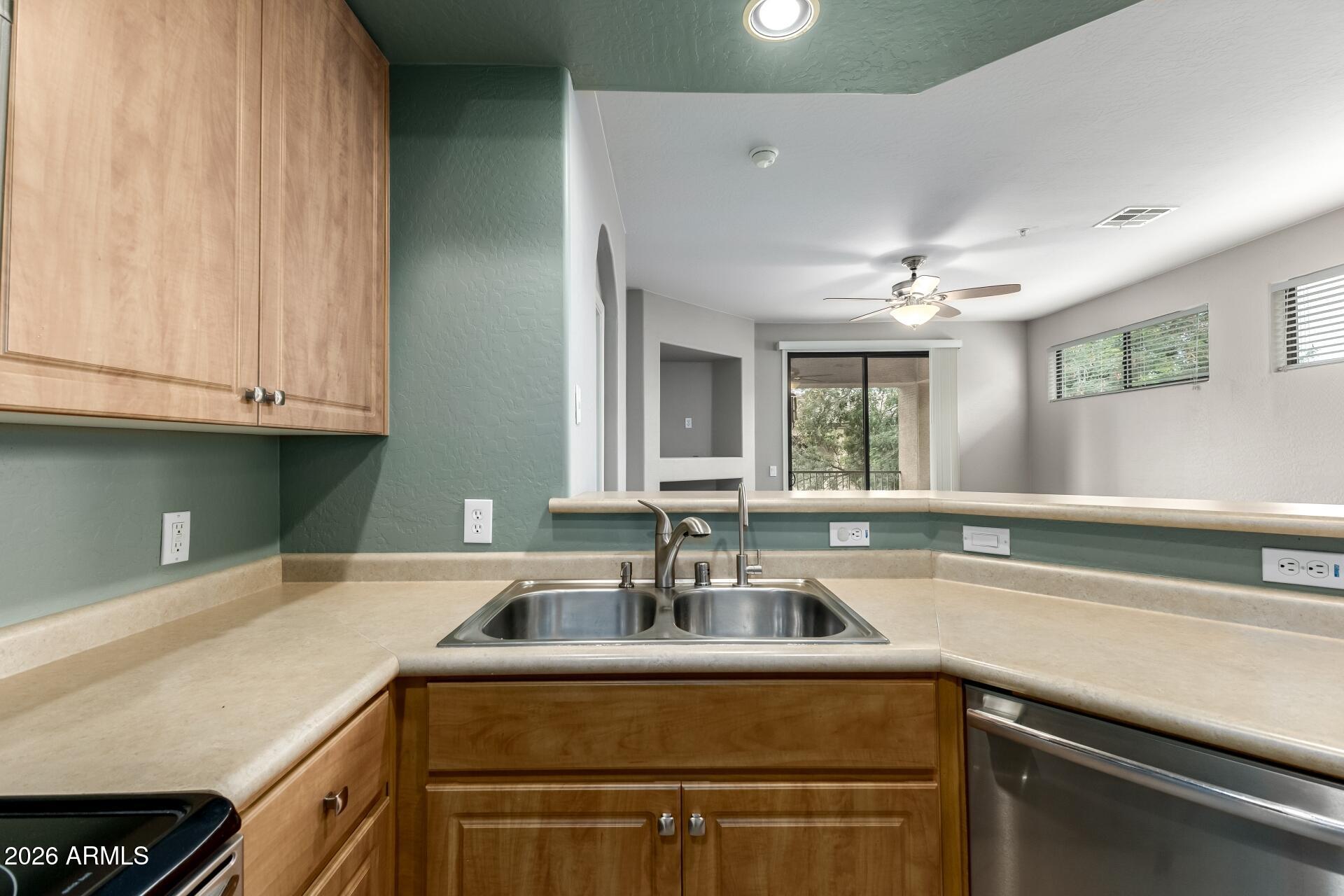 705 West Queen Creek Road, Unit 2114 Chandler, AZ 85248 - Photo 17 of 36 a kitchen with a sink and cabinets