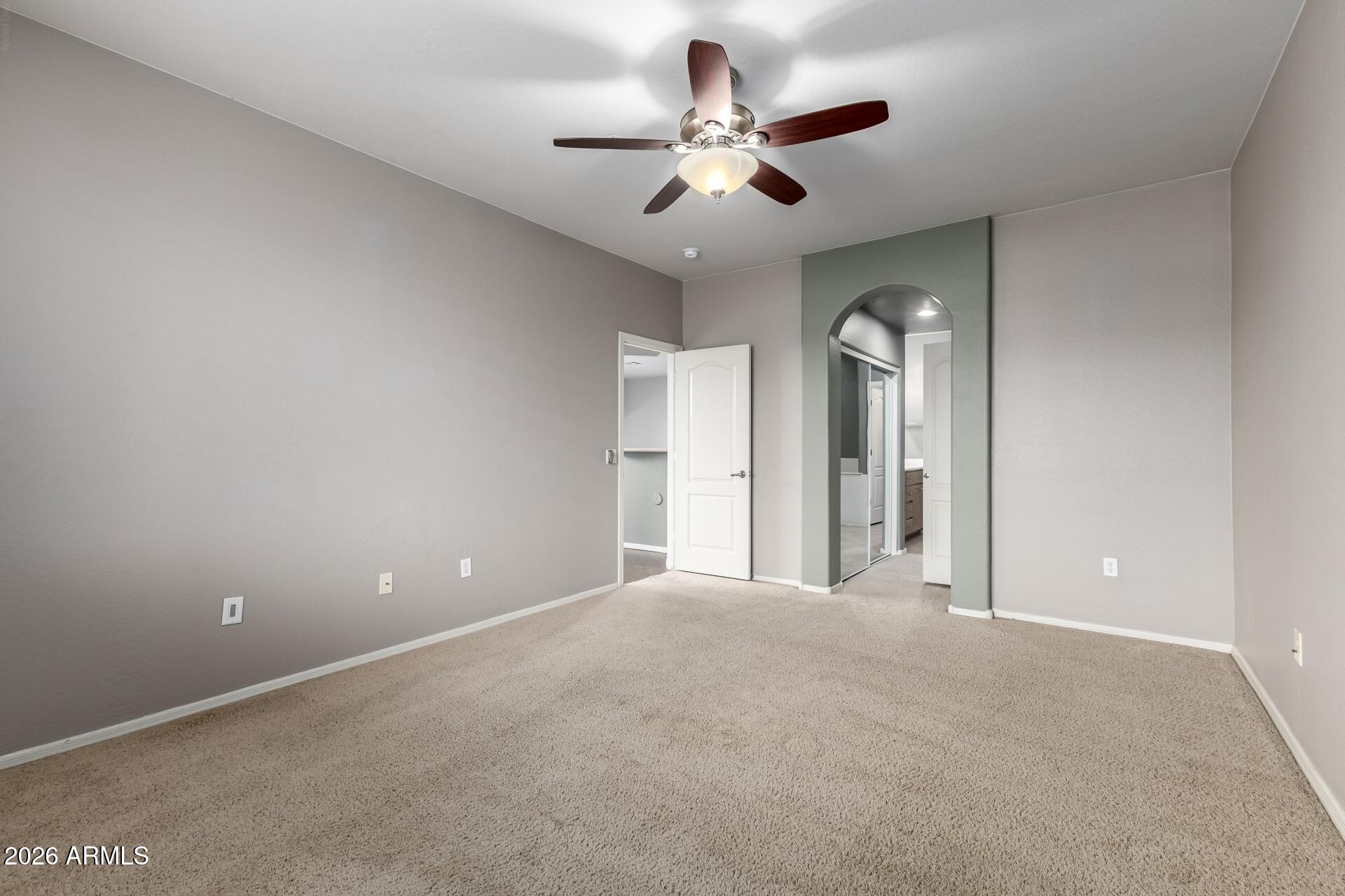 705 West Queen Creek Road, Unit 2114 Chandler, AZ 85248 - Photo 21 of 36 a view of a big room with chandelier fan and windows