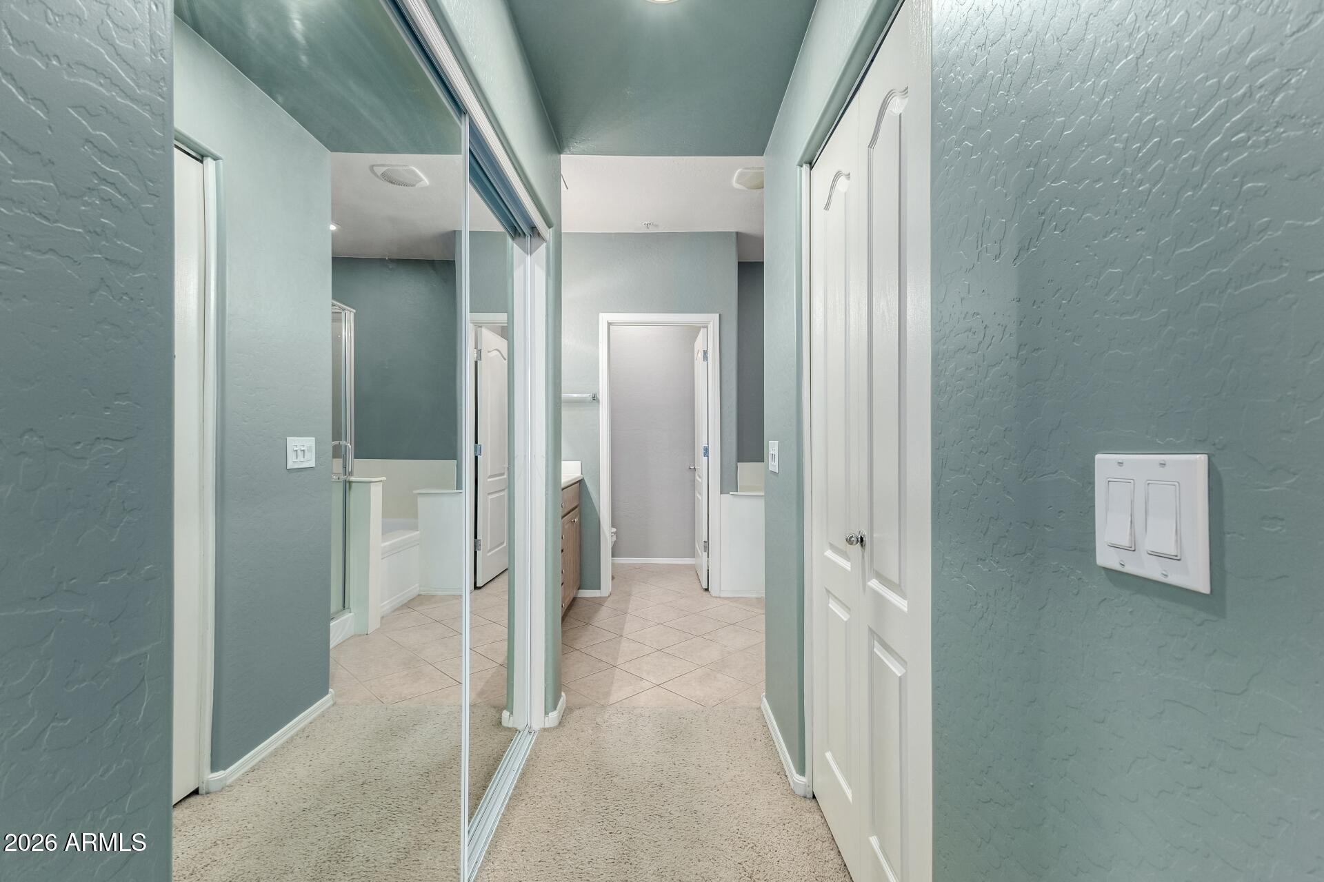 705 West Queen Creek Road, Unit 2114 Chandler, AZ 85248 - Photo 22 of 36 a view of a hallway with wooden shelves