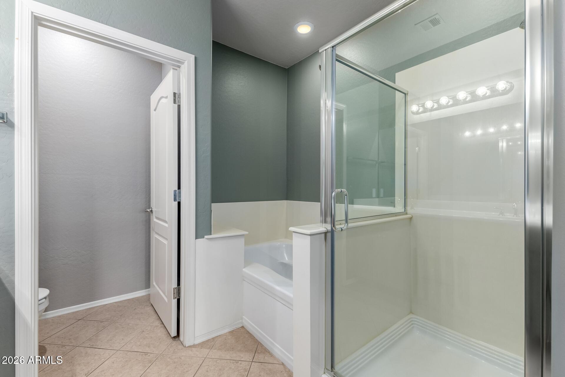 705 West Queen Creek Road, Unit 2114 Chandler, AZ 85248 - Photo 24 of 36 a bathroom with a glass shower door and a glass door