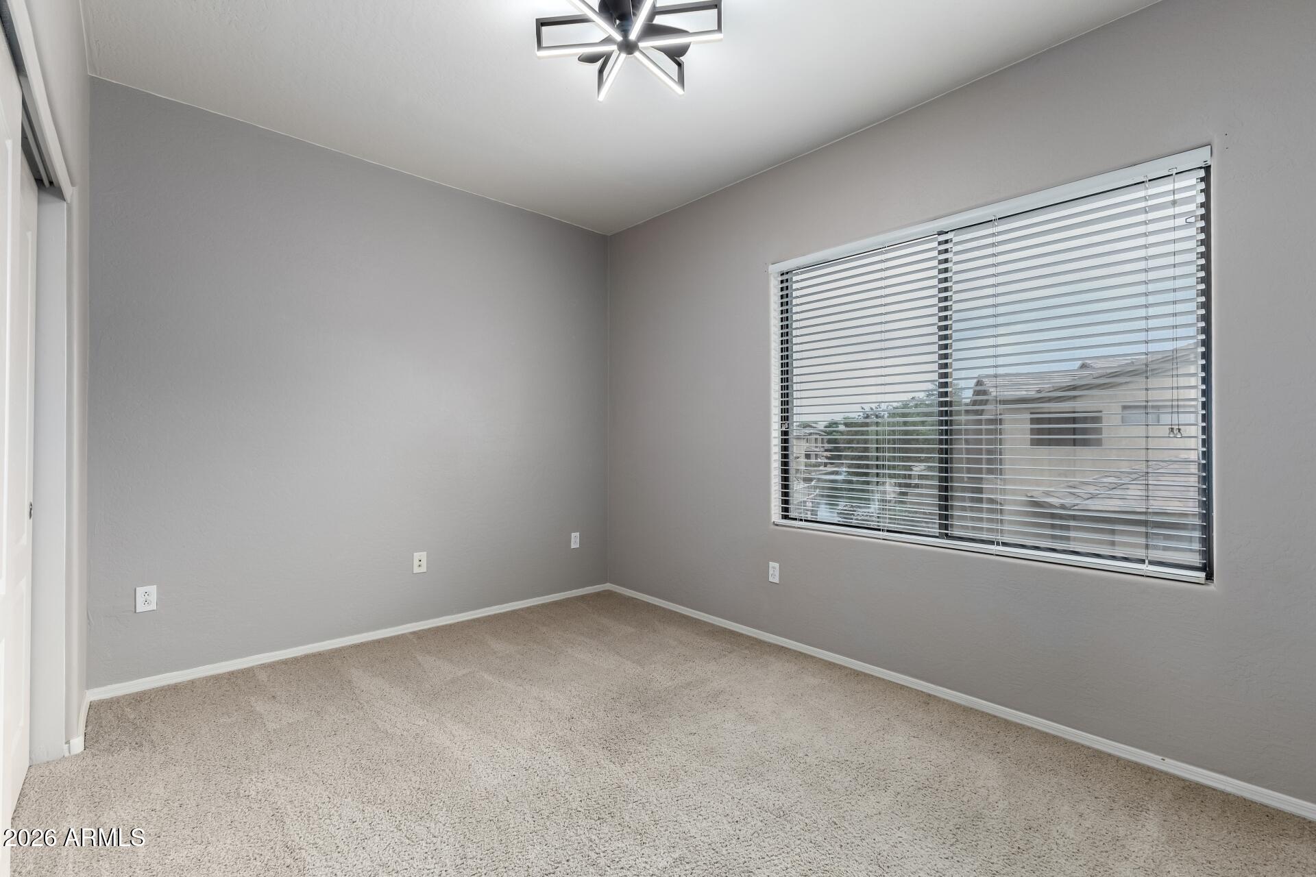 705 West Queen Creek Road, Unit 2114 Chandler, AZ 85248 - Photo 26 of 36 a view of an empty room with a window