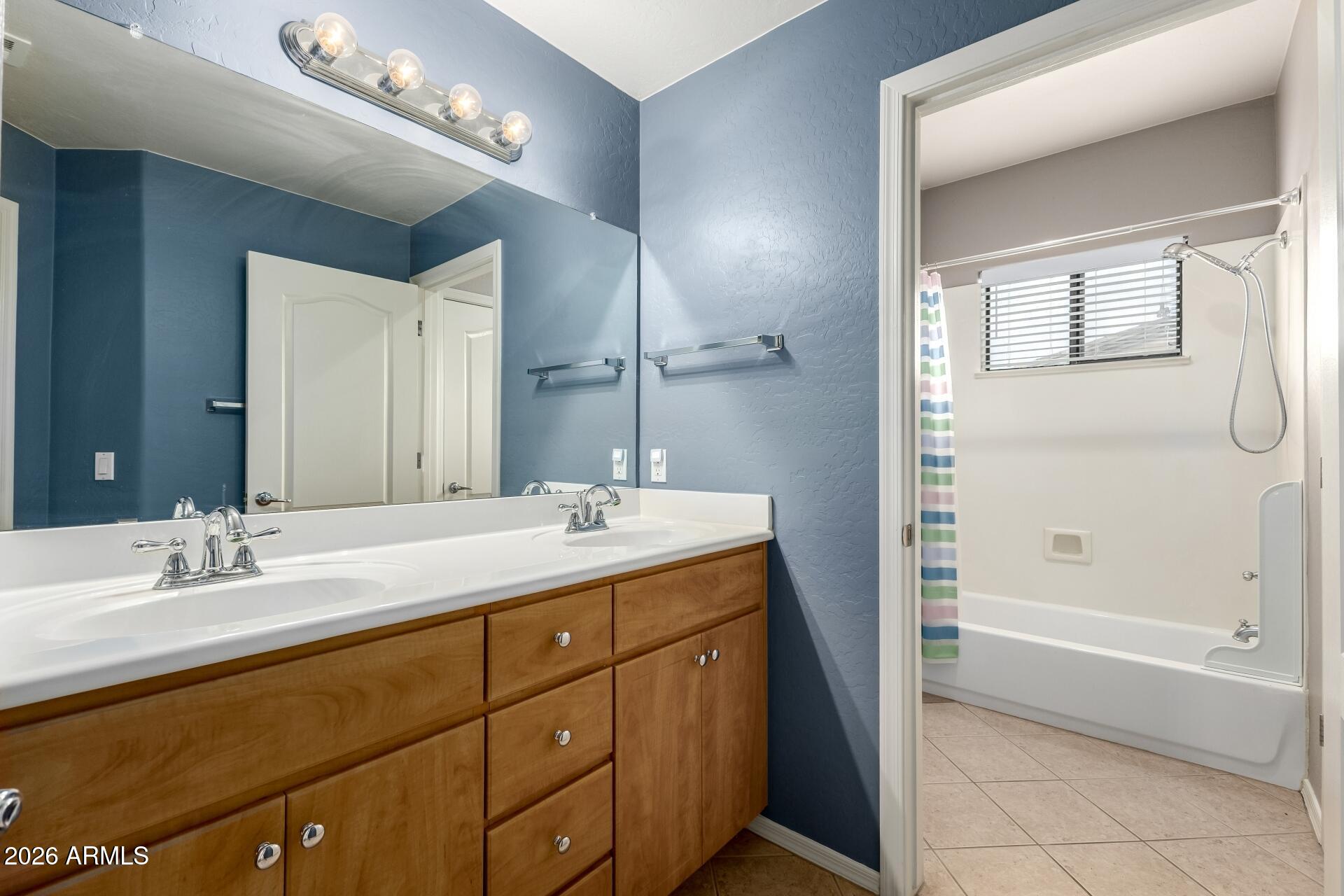 705 West Queen Creek Road, Unit 2114 Chandler, AZ 85248 - Photo 28 of 36 a bathroom with a sink double vanity granite tub and shower