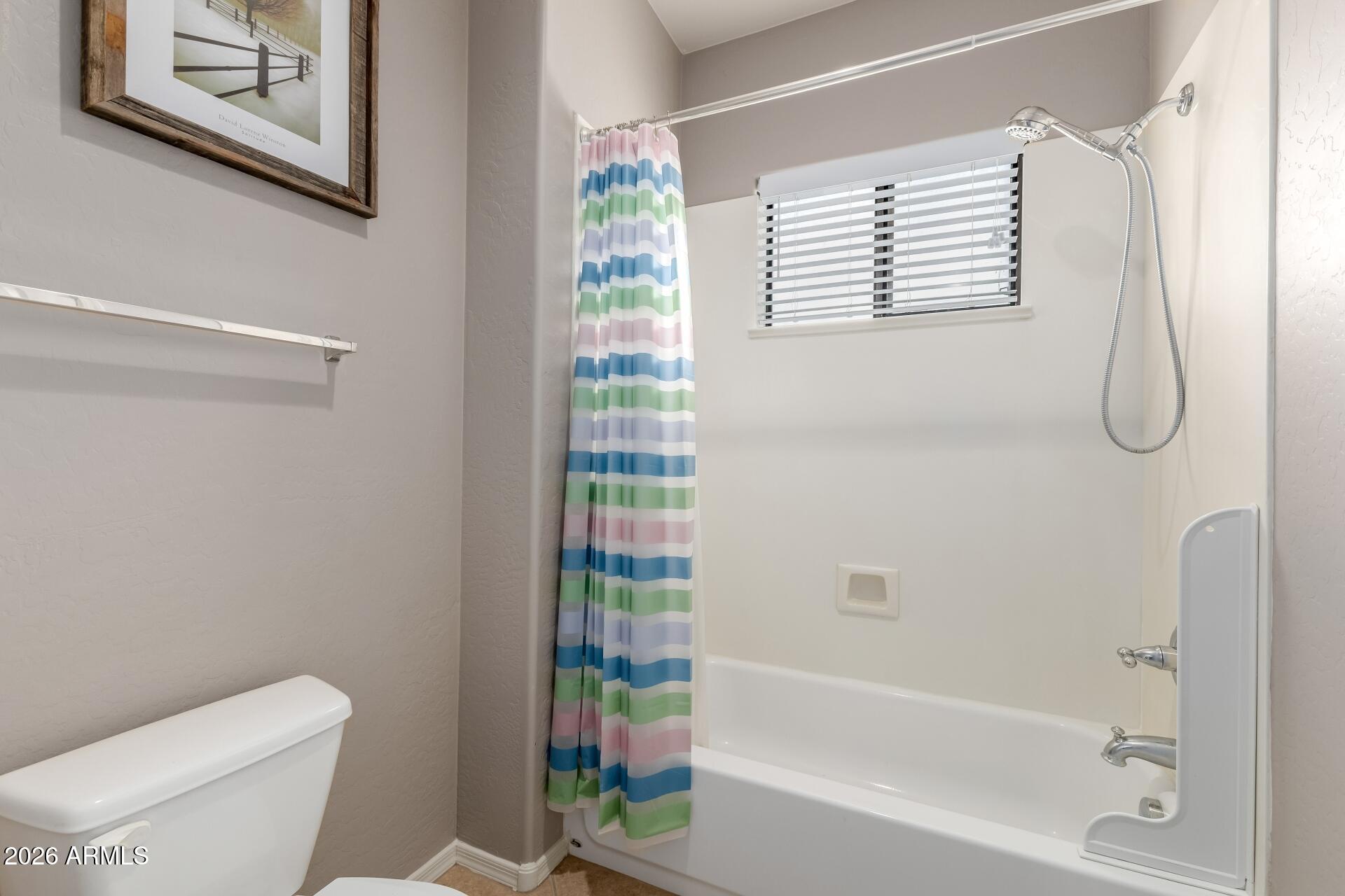 705 West Queen Creek Road, Unit 2114 Chandler, AZ 85248 - Photo 29 of 36 a bathroom with a toilet and a bathtub