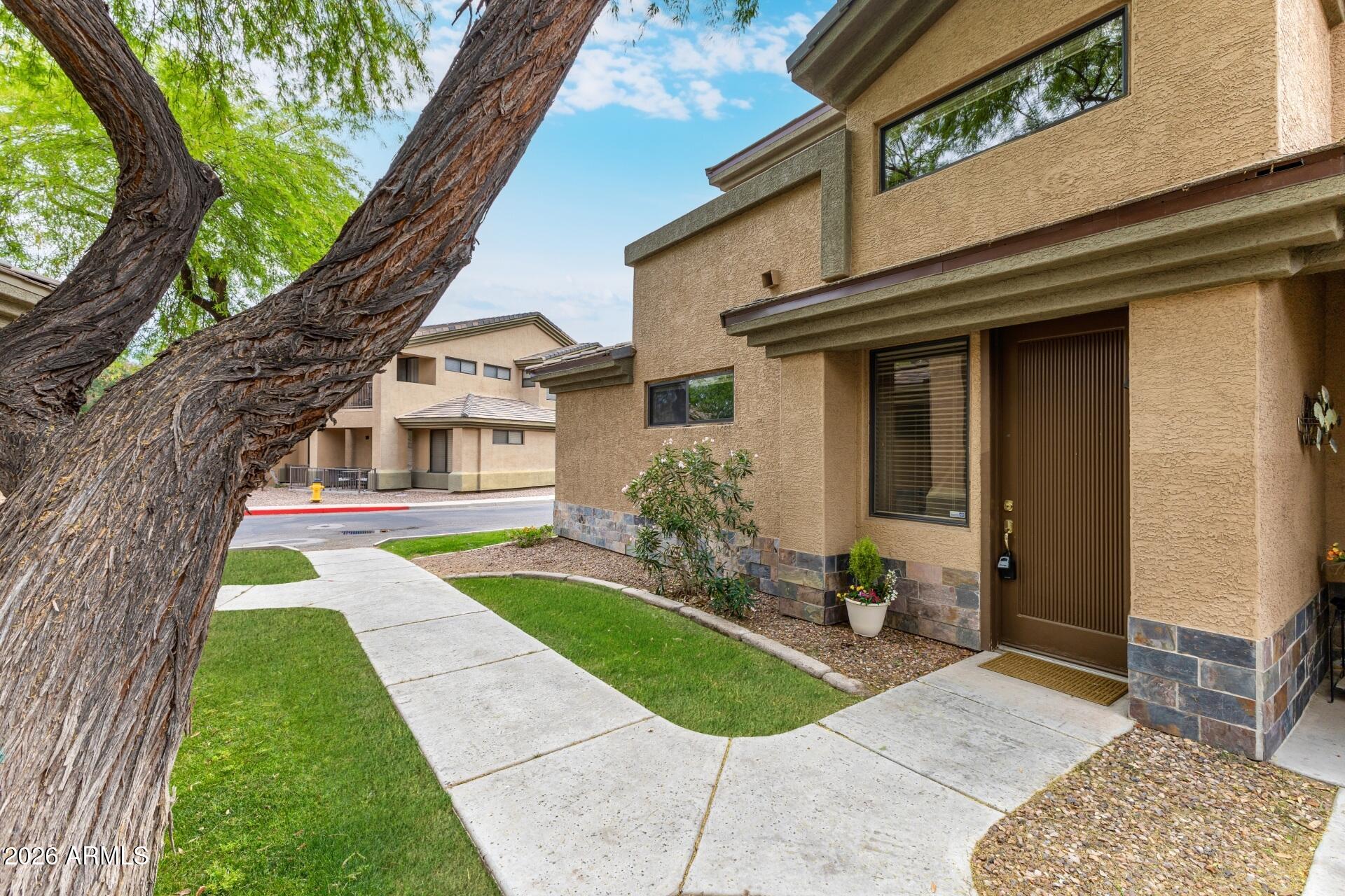 705 West Queen Creek Road, Unit 2114 Chandler, AZ 85248 - Photo 3 of 36 a house view with a outdoor space