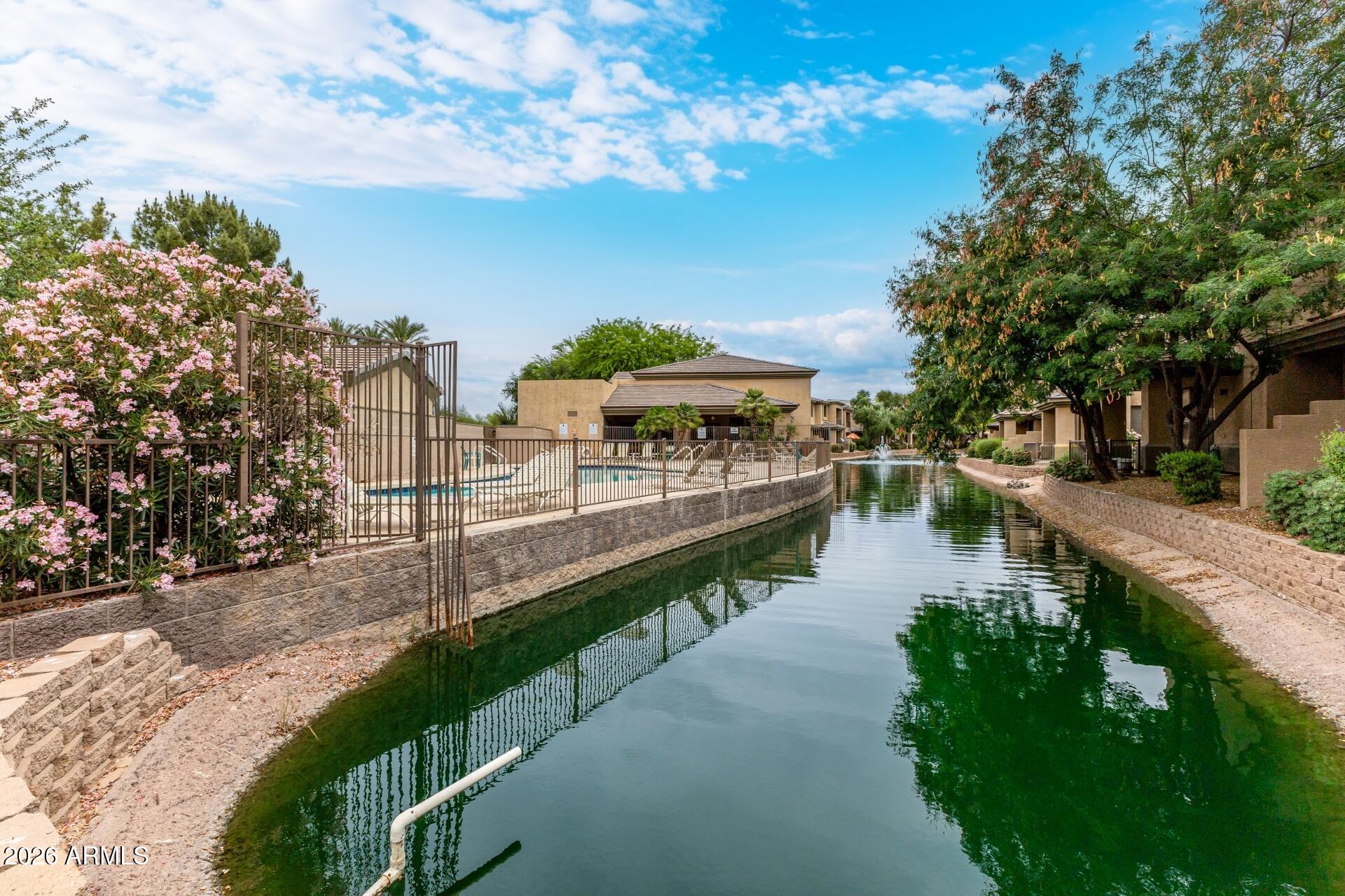 705 West Queen Creek Road, Unit 2114 Chandler, AZ 85248 - Photo 36 of 36 a view of a lake with a garden