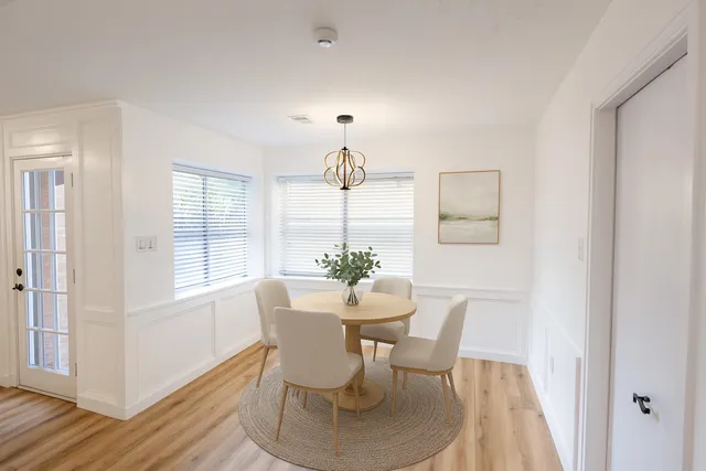 a view of a big room with a ceiling fan