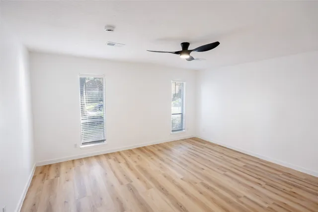 an aerial view of a house with a yard basket ball court and outdoor seating