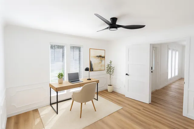 a kitchen with a sink appliances and cabinets