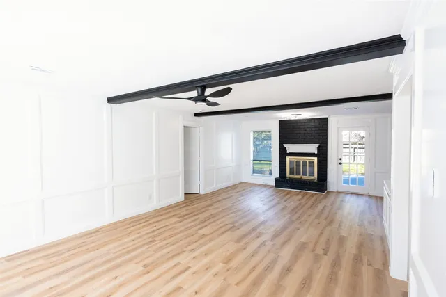 a kitchen with white cabinets and a sink