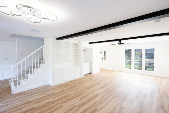 a white toilet sitting next to a shower