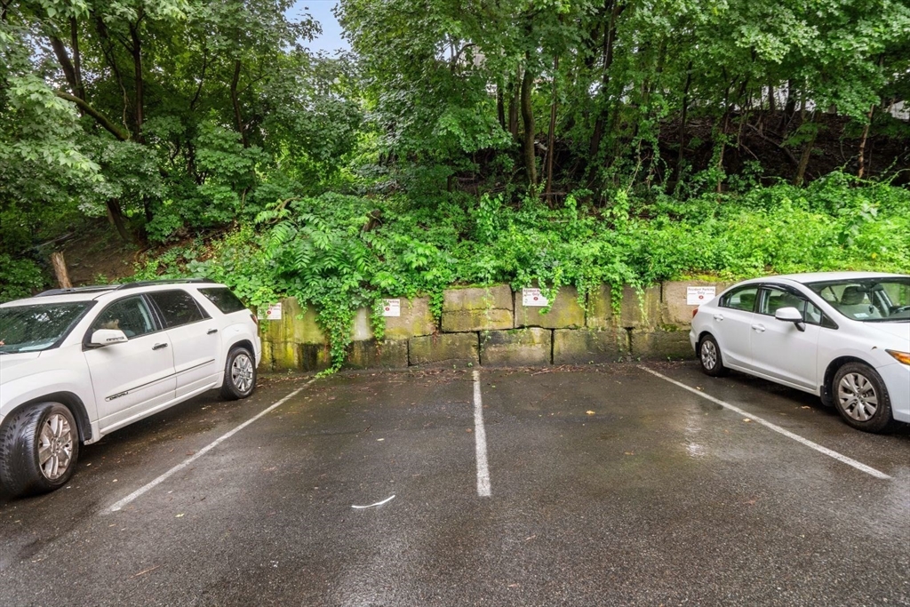 570 Washington Street, Unit 3 Boston, MA 02135 - Photo 11 of 11 a view of a car parked in a parking space
