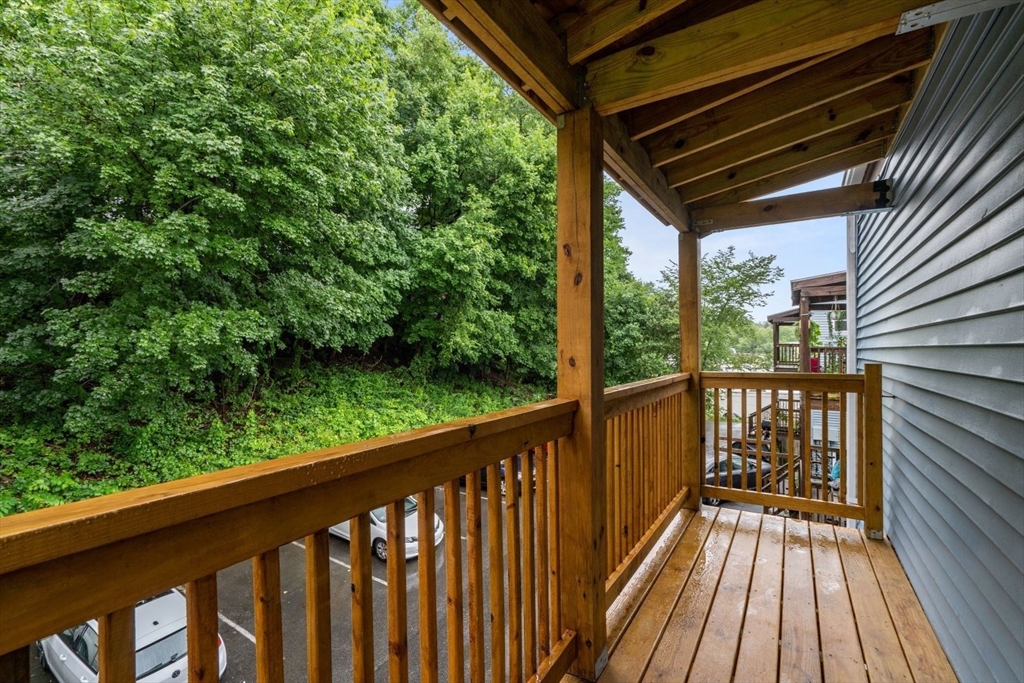 570 Washington Street, Unit 3 Boston, MA 02135 - Photo 8 of 11 a view of balcony with wooden floor