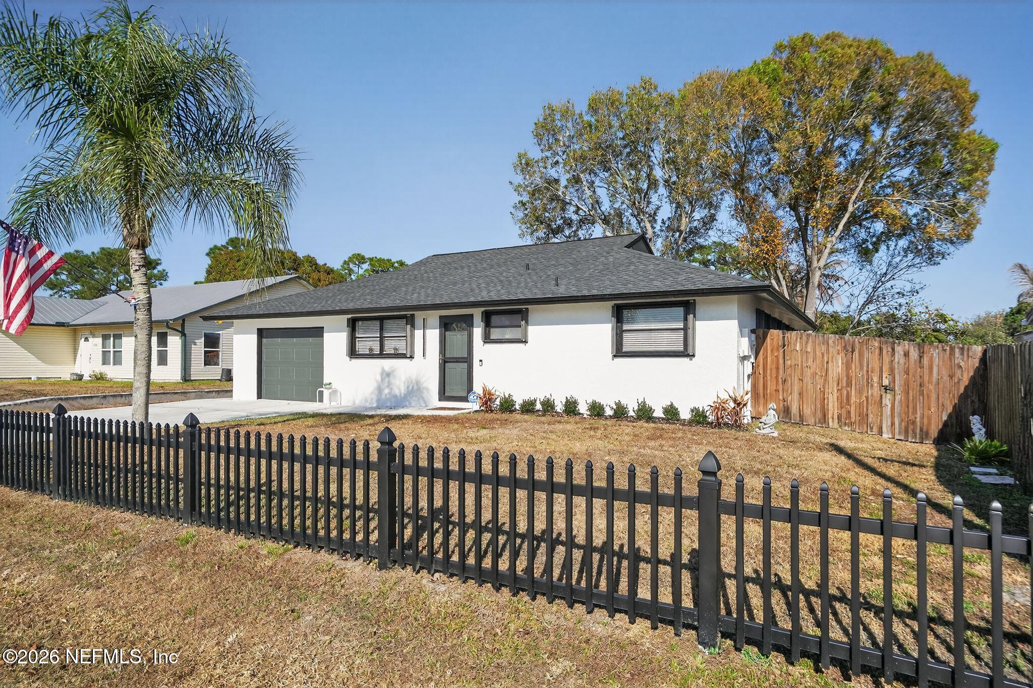 4543 Southeast Dryfus Avenue Stuart, FL 34997 - Photo 2 of 46 a front view of a house having patio