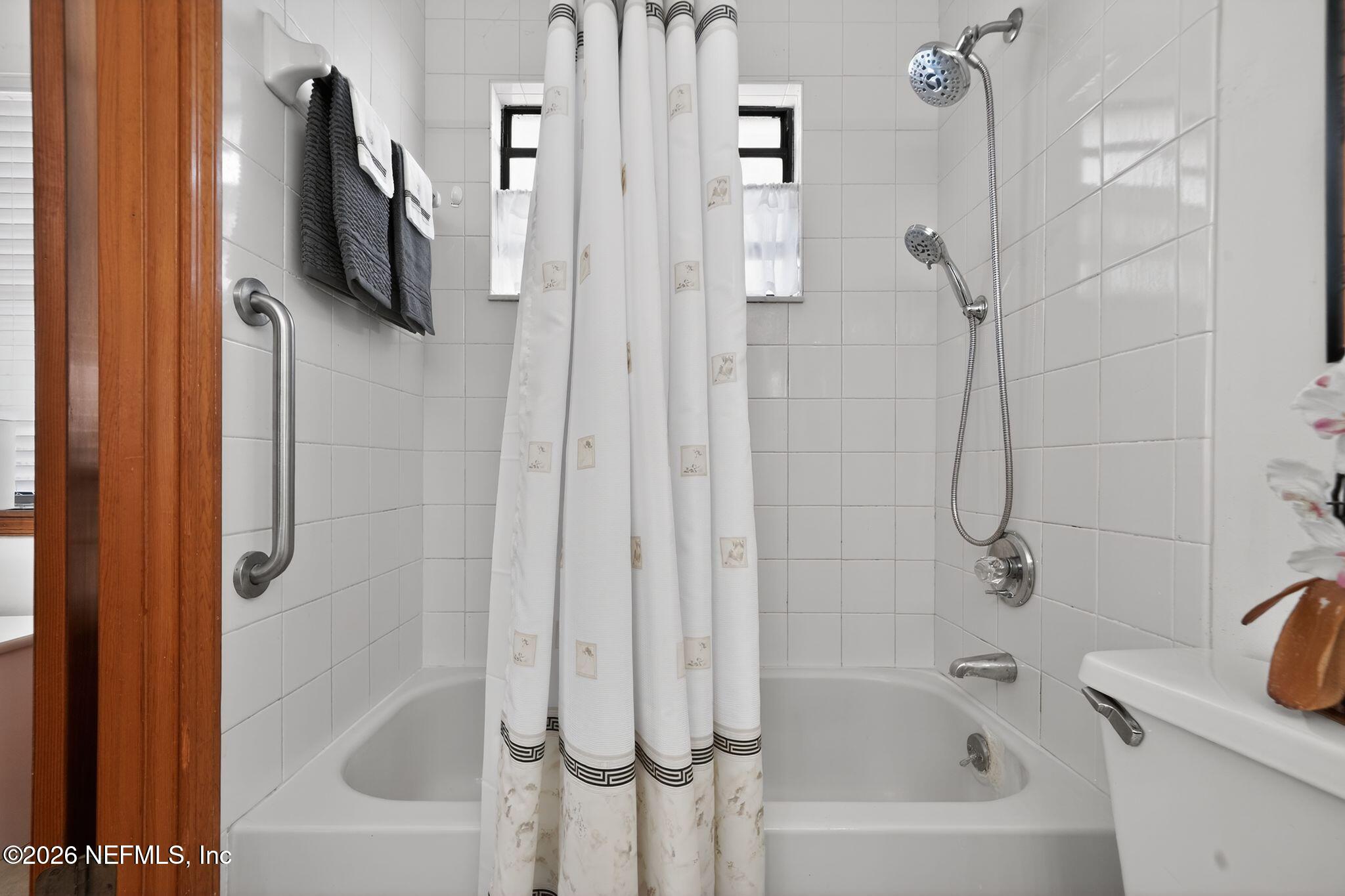4543 Southeast Dryfus Avenue Stuart, FL 34997 - Photo 22 of 46 a bathroom with a bathtub a shower and a sink