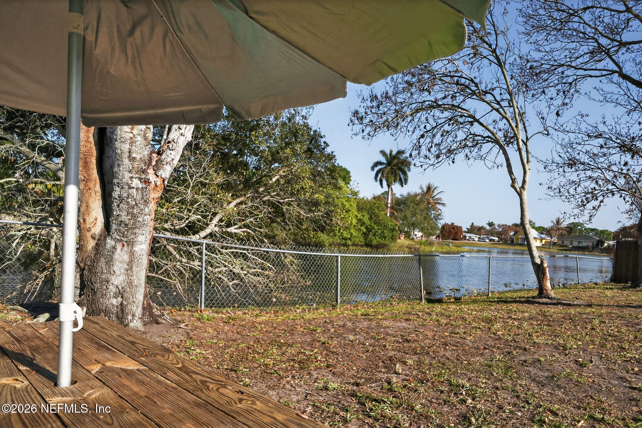 4543 Southeast Dryfus Avenue Stuart, FL 34997 - Photo 32 of 46 a view of a backyard