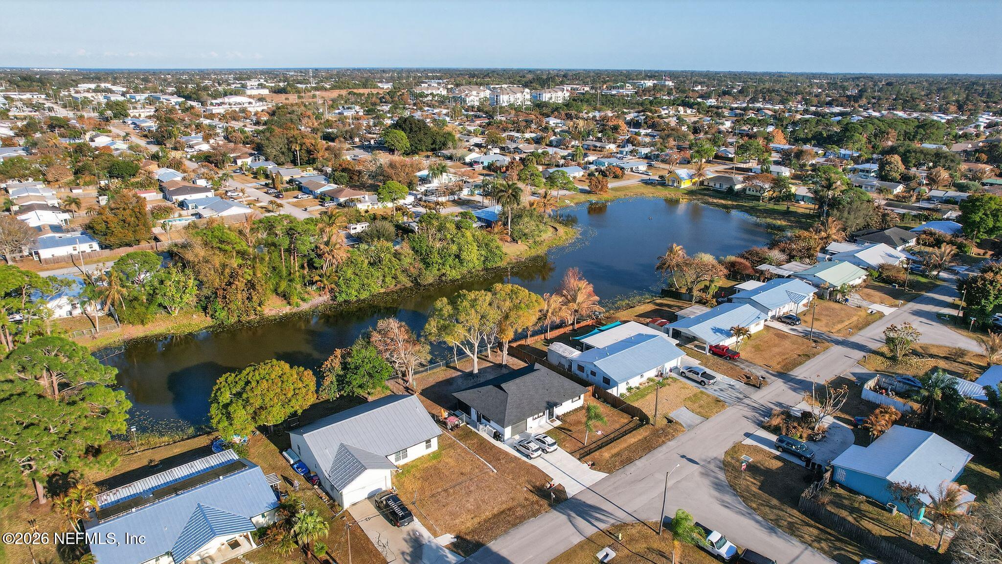 4543 Southeast Dryfus Avenue Stuart, FL 34997 - Photo 45 of 46 an aerial view of residential houses with outdoor space