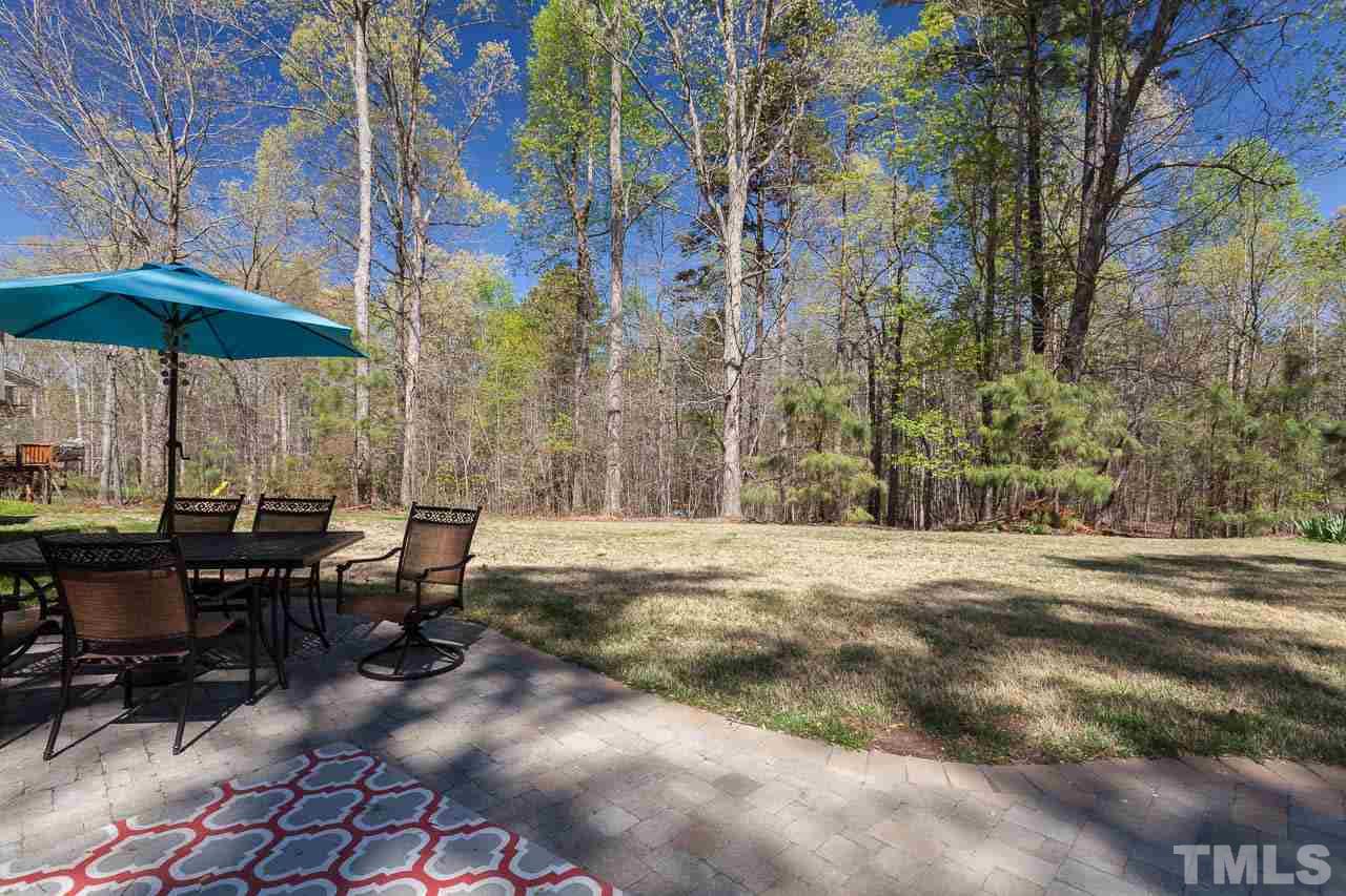 5216 Levering Mill Road Apex, NC 27539 - Photo 12 of 23 a view of a backyard with sitting area