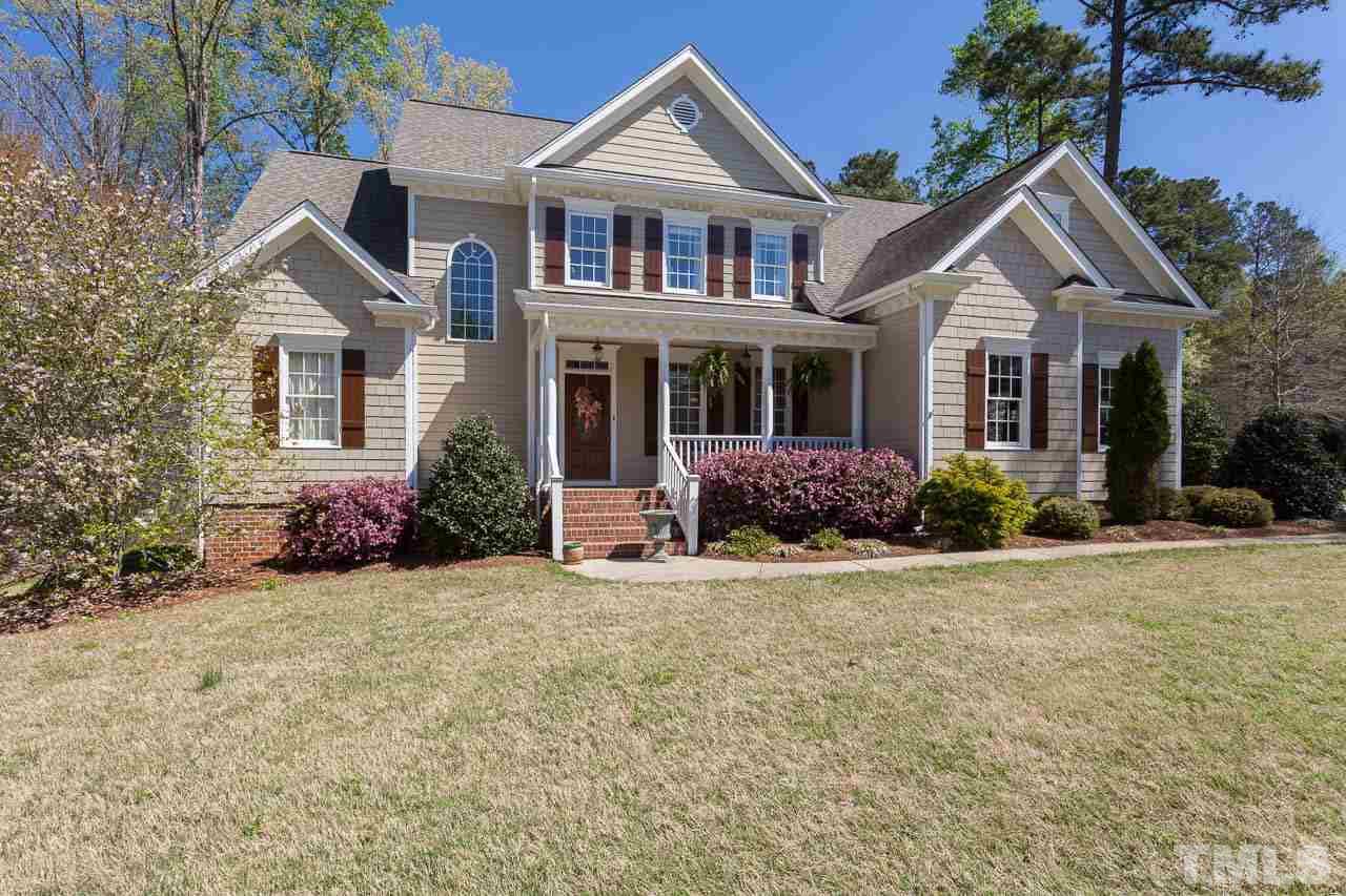 5216 Levering Mill Road Apex, NC 27539 - Photo 23 of 23 a view of a house with yard and plants