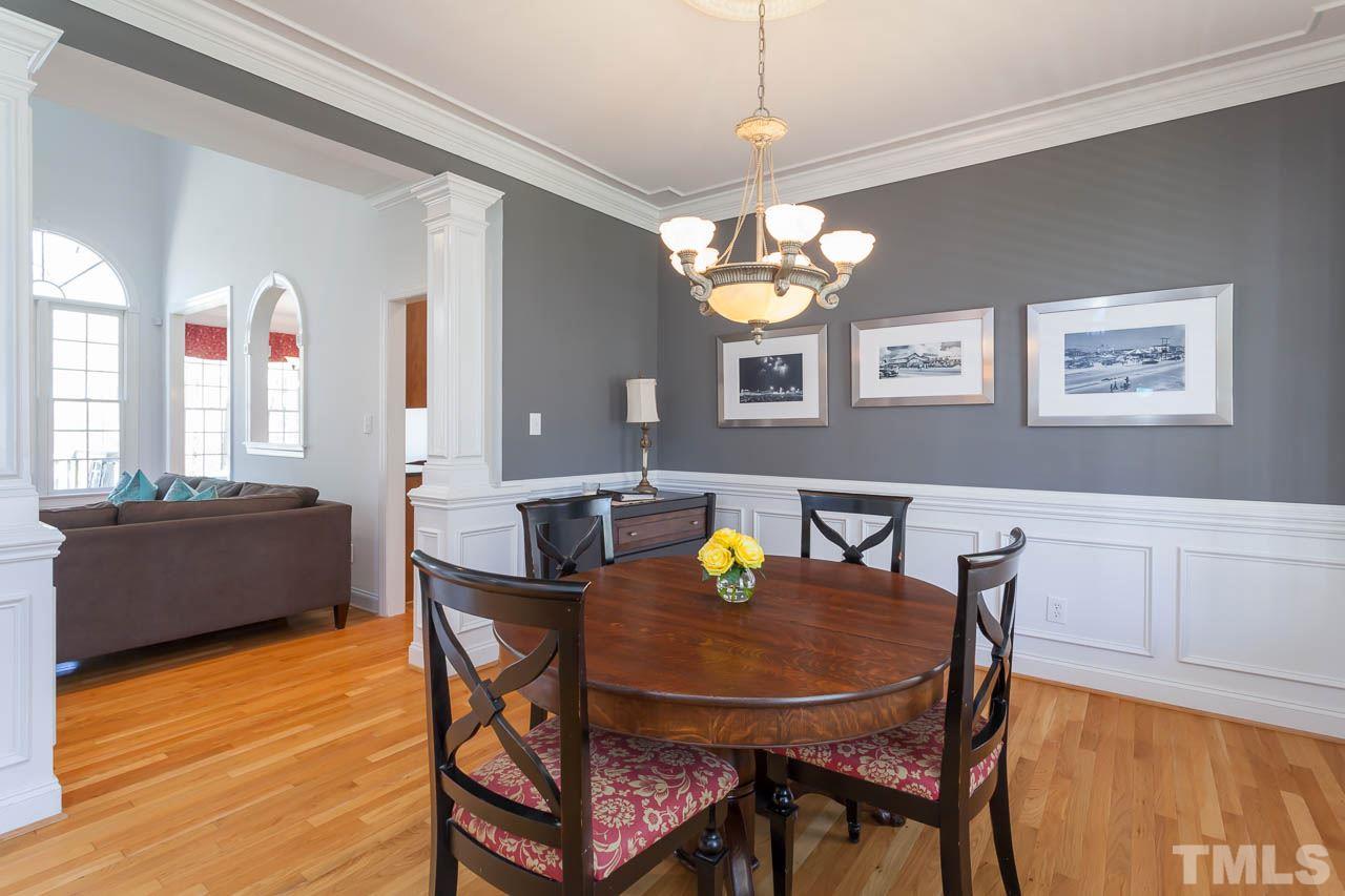 5216 Levering Mill Road Apex, NC 27539 - Photo 4 of 23 a view of a dining room with furniture and wooden floor