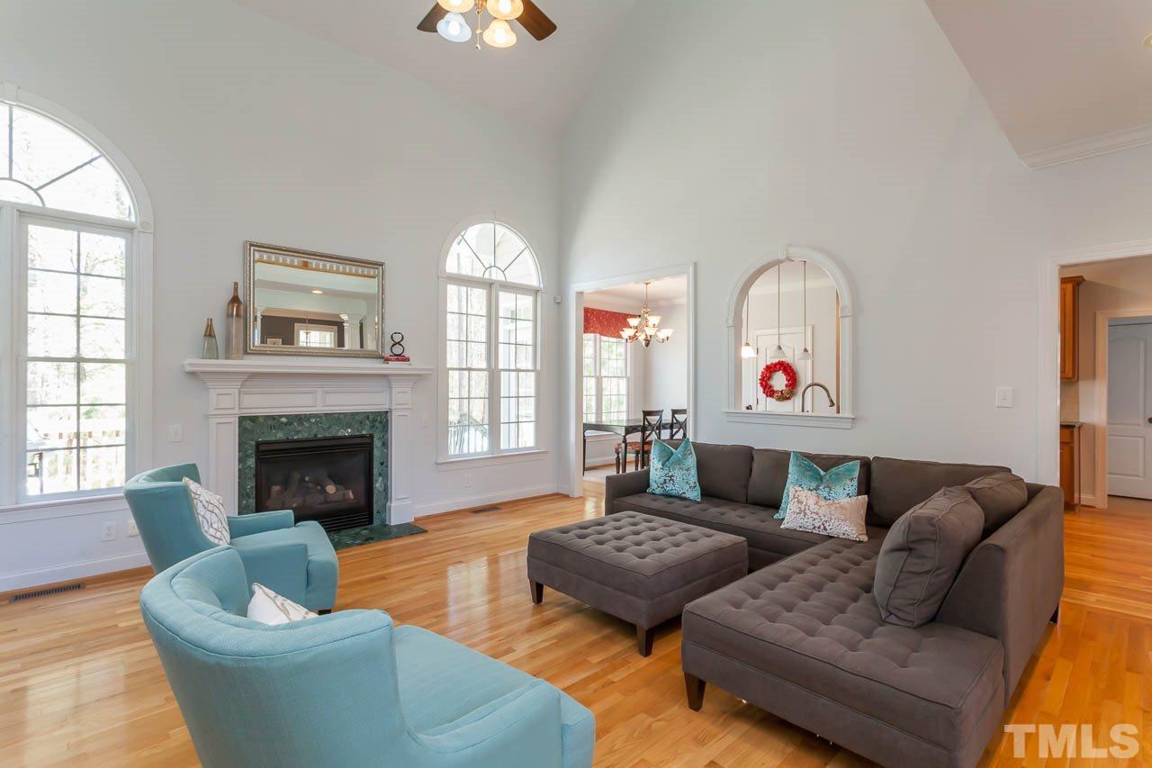 5216 Levering Mill Road Apex, NC 27539 - Photo 5 of 23 a living room with furniture and a fireplace