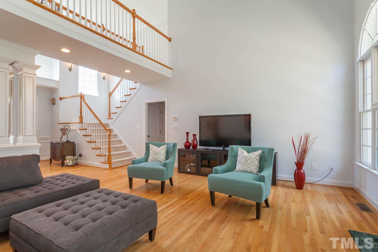 5216 Levering Mill Road Apex, NC 27539 - Photo 6 of 23 a living room with furniture and a flat screen tv