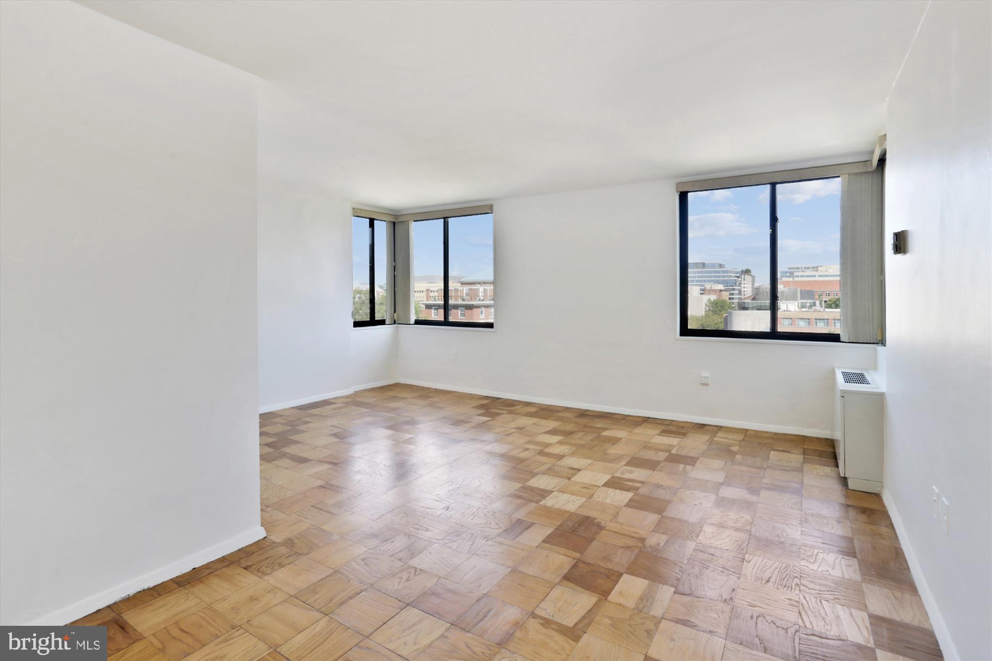 2030 F Street Northwest, Unit 906 Washington, DC 20006 - Photo 12 of 33 an empty room with windows
