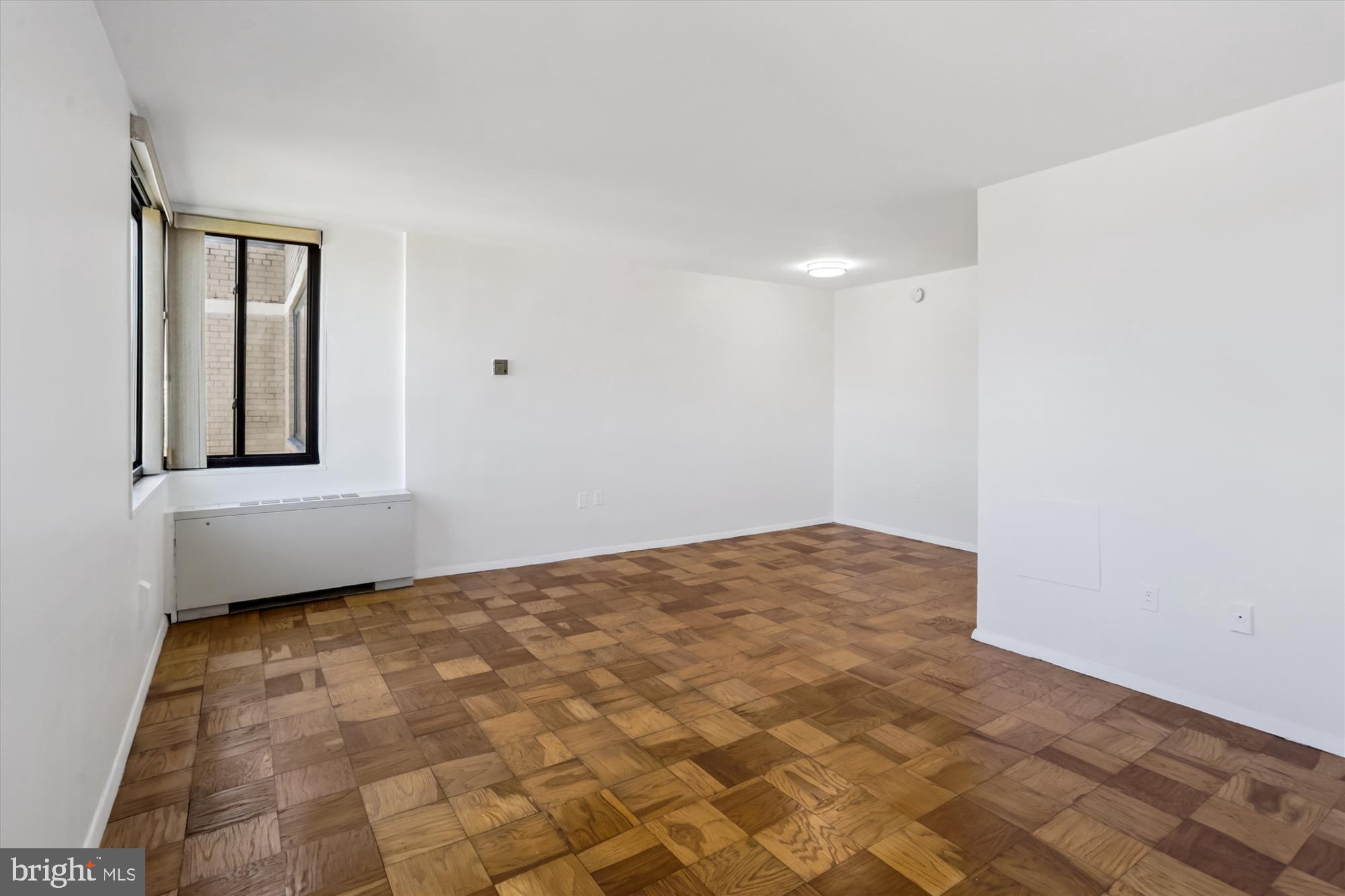 2030 F Street Northwest, Unit 906 Washington, DC 20006 - Photo 18 of 33 a view of an empty room and window