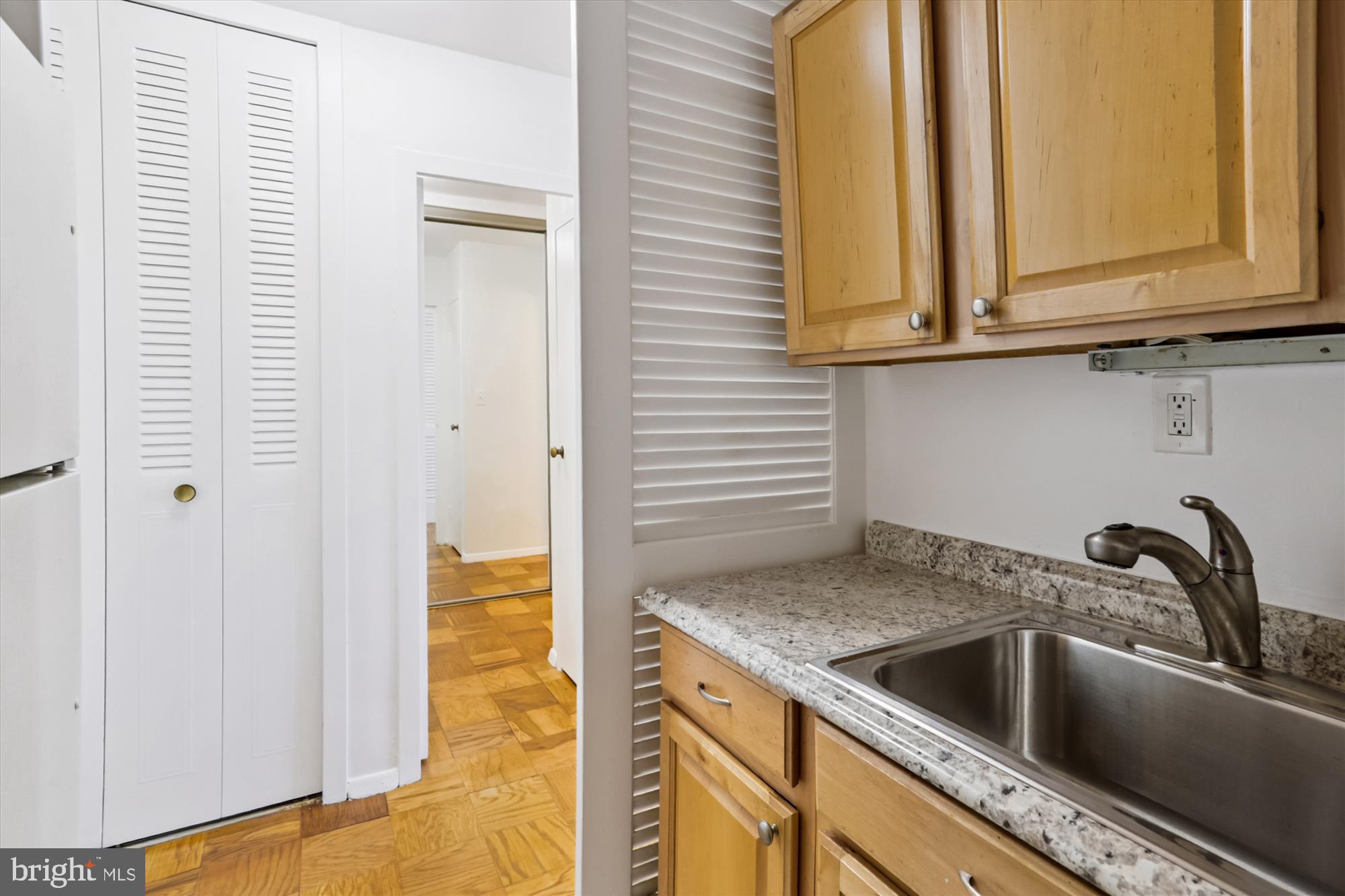 2030 F Street Northwest, Unit 906 Washington, DC 20006 - Photo 24 of 33 a bathroom with a sink and a mirror