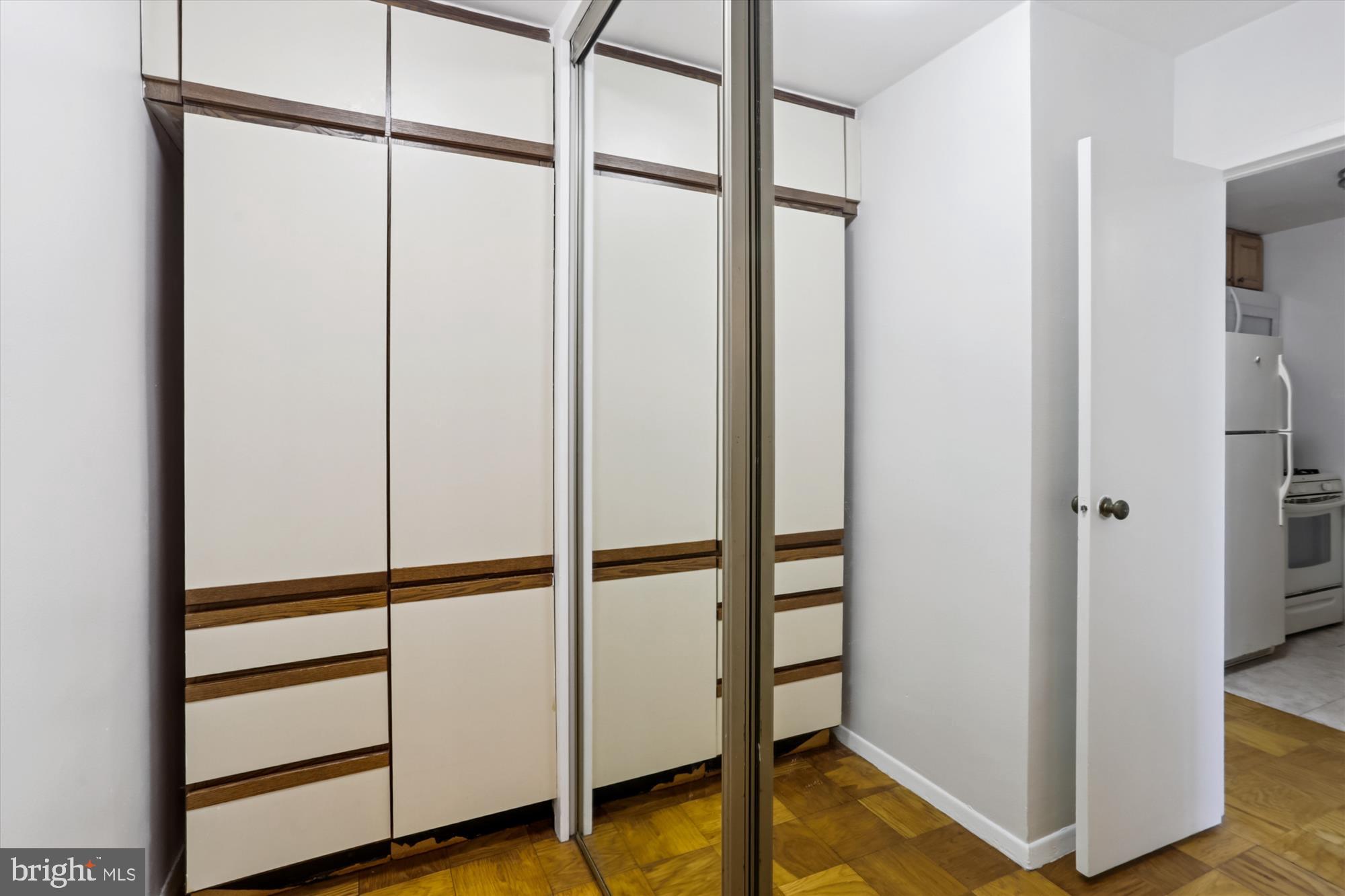 2030 F Street Northwest, Unit 906 Washington, DC 20006 - Photo 25 of 33 a view of walk in closet with empty racks