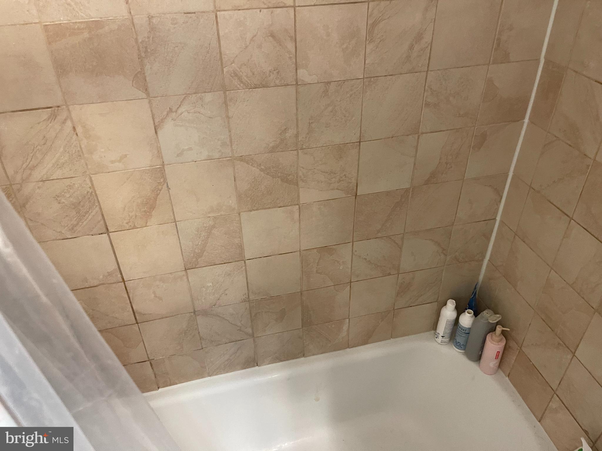 2030 F Street Northwest, Unit 906 Washington, DC 20006 - Photo 30 of 33 a bathroom with a bathtub