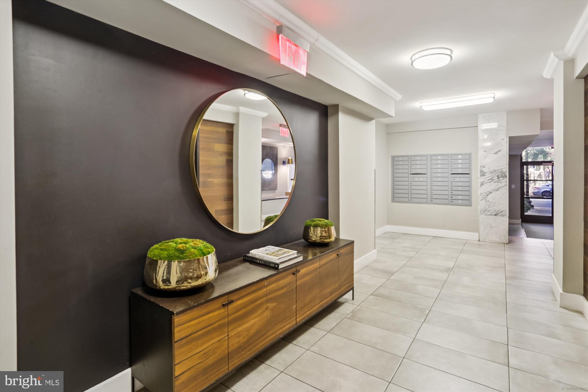 2030 F Street Northwest, Unit 906 Washington, DC 20006 - Photo 6 of 33 an entryway with sitting space and wooden floor