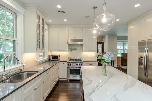 a kitchen with refrigerator and cabinets