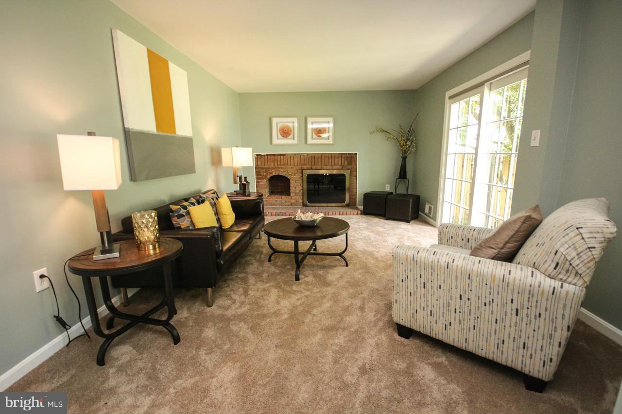 1429 Winding Waye Lane Silver Spring, MD 20902 - Photo 12 of 30 a living room with furniture and a fireplace