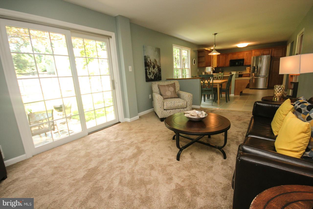1429 Winding Waye Lane Silver Spring, MD 20902 - Photo 14 of 30 a living room with furniture and a large window