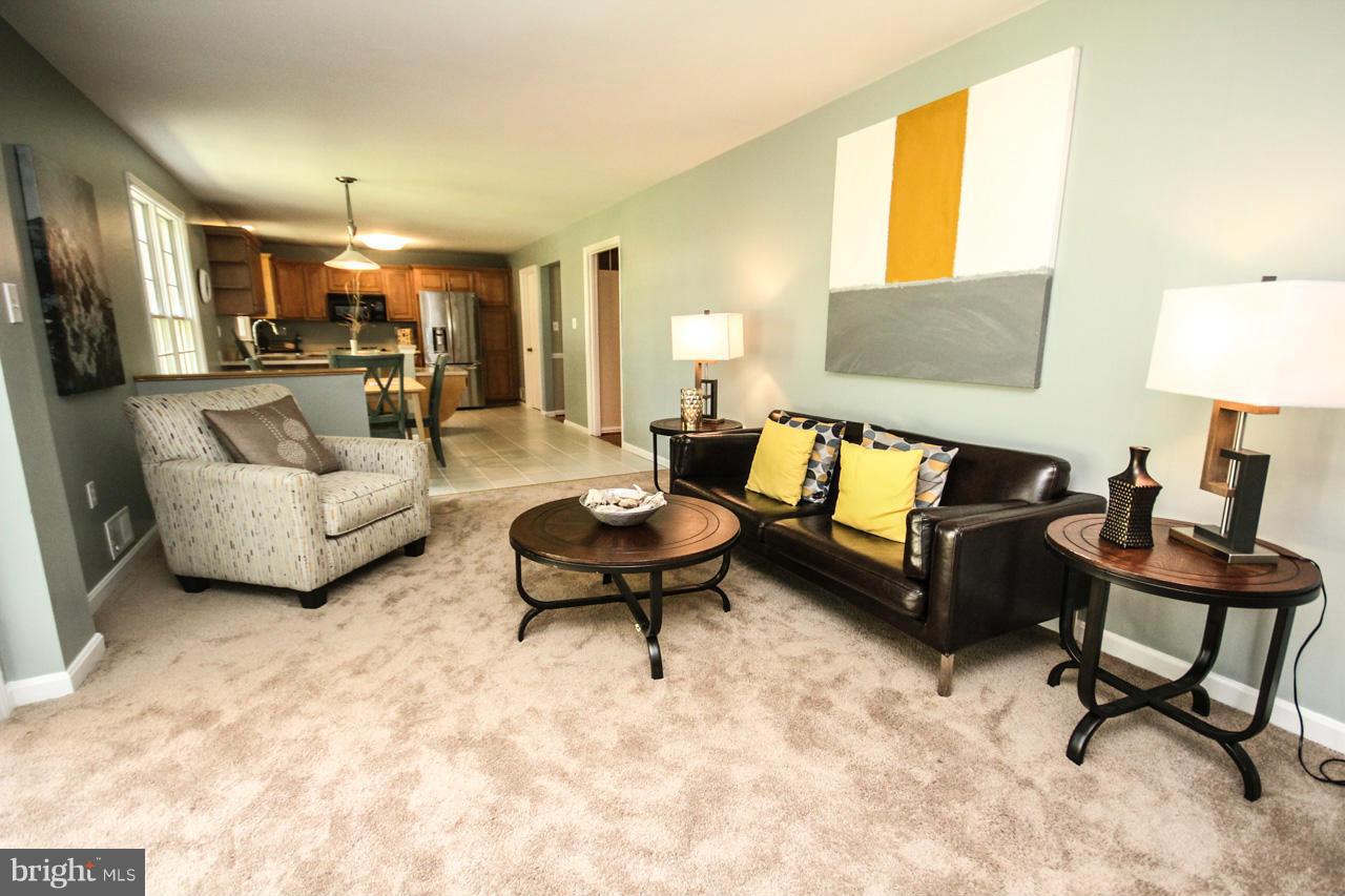 1429 Winding Waye Lane Silver Spring, MD 20902 - Photo 15 of 30 a living room with furniture and a couch