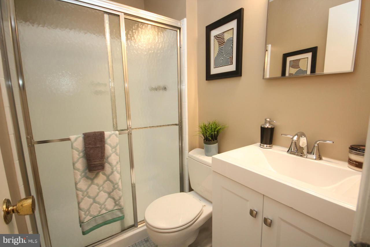 1429 Winding Waye Lane Silver Spring, MD 20902 - Photo 21 of 30 a bathroom with a sink toilet and shower