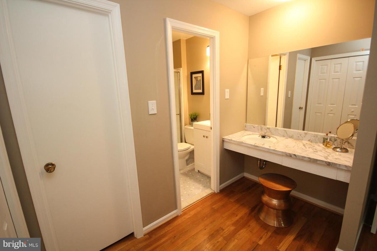1429 Winding Waye Lane Silver Spring, MD 20902 - Photo 22 of 30 a bathroom with a sink a toilet and shower