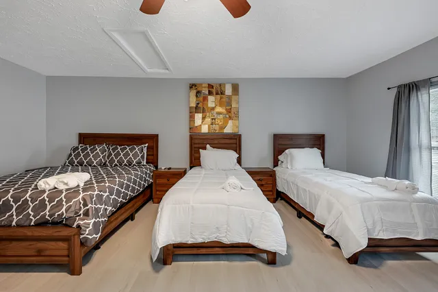 a bedroom with double bed and window